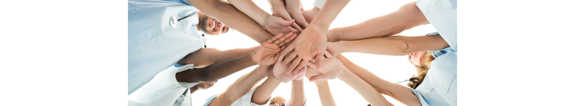 Directly below shot of multiethnic medical team stacking hands